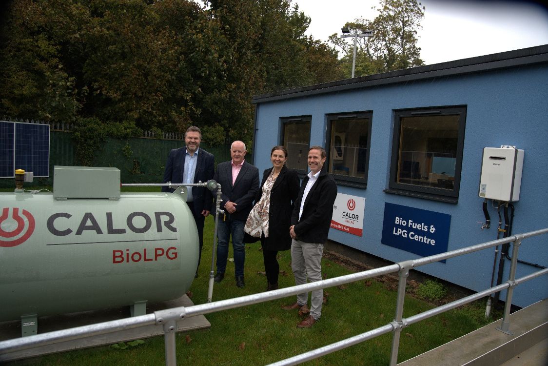 Richard Alexander of Calor, Stephen McGreevy (SERC), Jill Jack (Calor) and Stephen Glover (SERC) by the Calor Bio LPG tank at SERC Holywood Campus